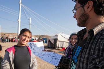 Mizgin, a translator, reads a letter from a girl named Megan that Heyat received in her box.